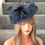 Thumbnail: Navy Blue sinamay Hatinator with mesh pleated top on a band 300925