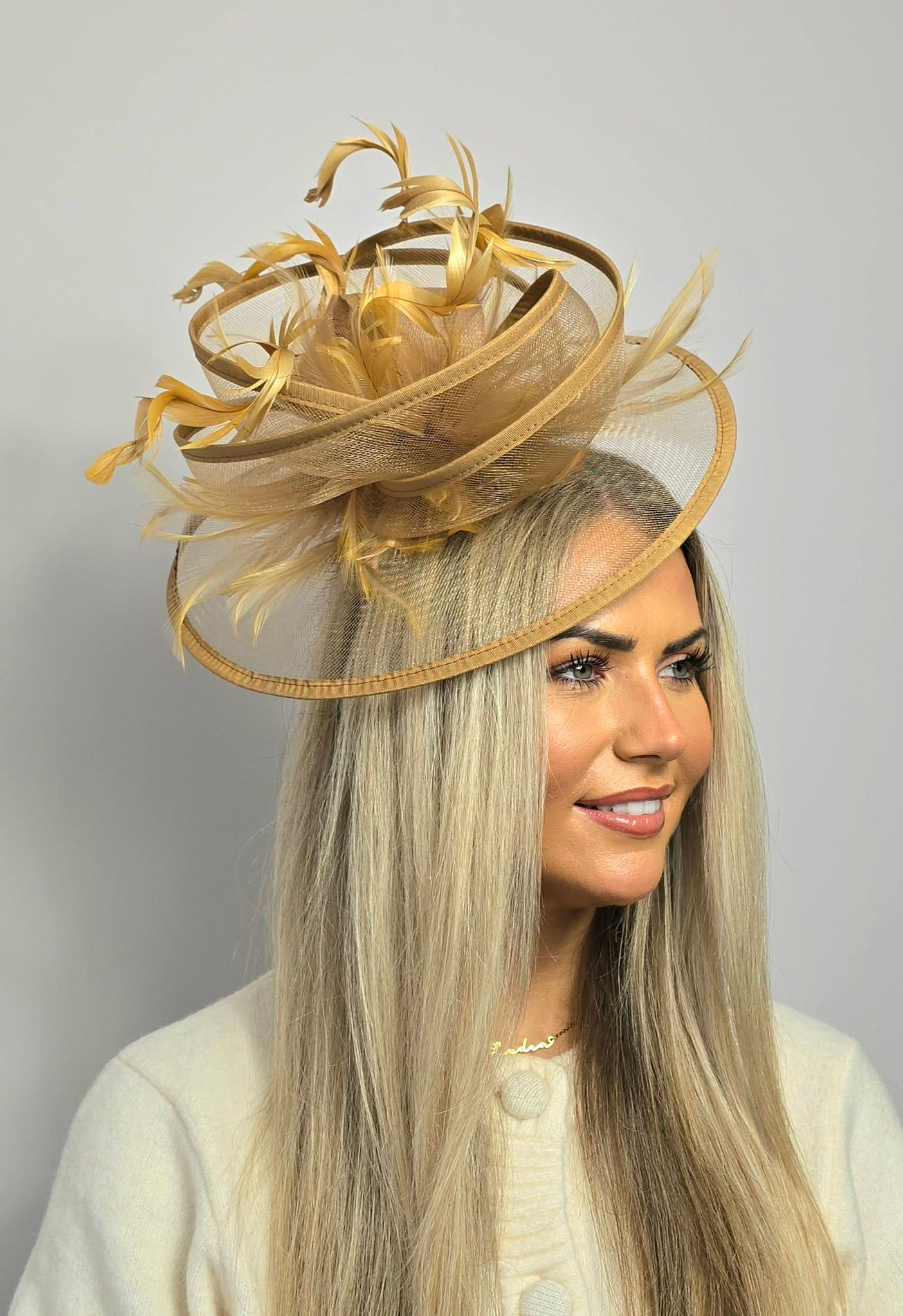 Gold mesh Fascinator with curled feathers on a band 220227