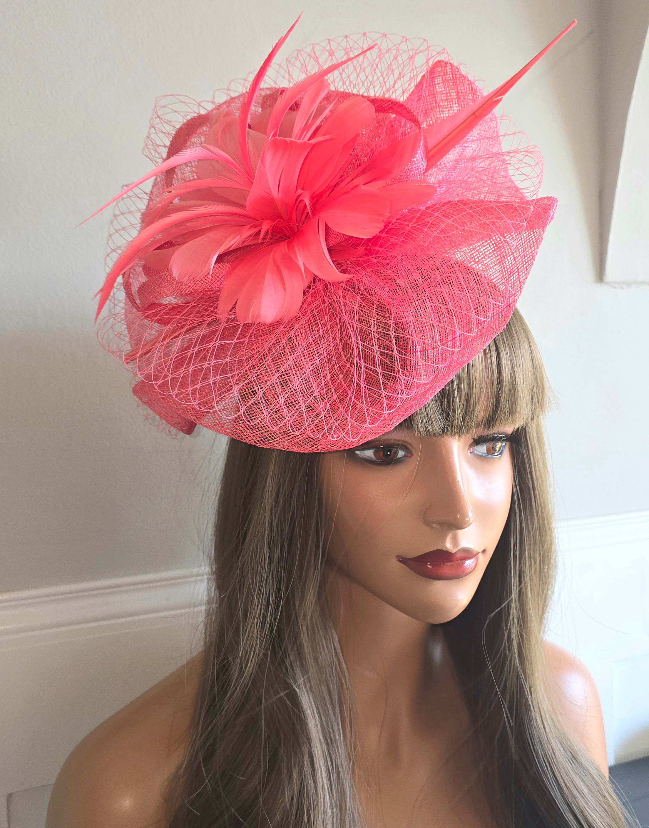 Coral sinamay Fascinator on a band 270726