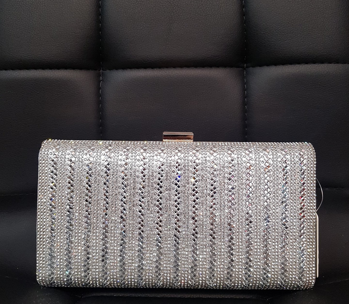 silver hard clutch bag