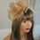 Thumbnail: Gold mesh Fascinator on a band with diamantes 150925