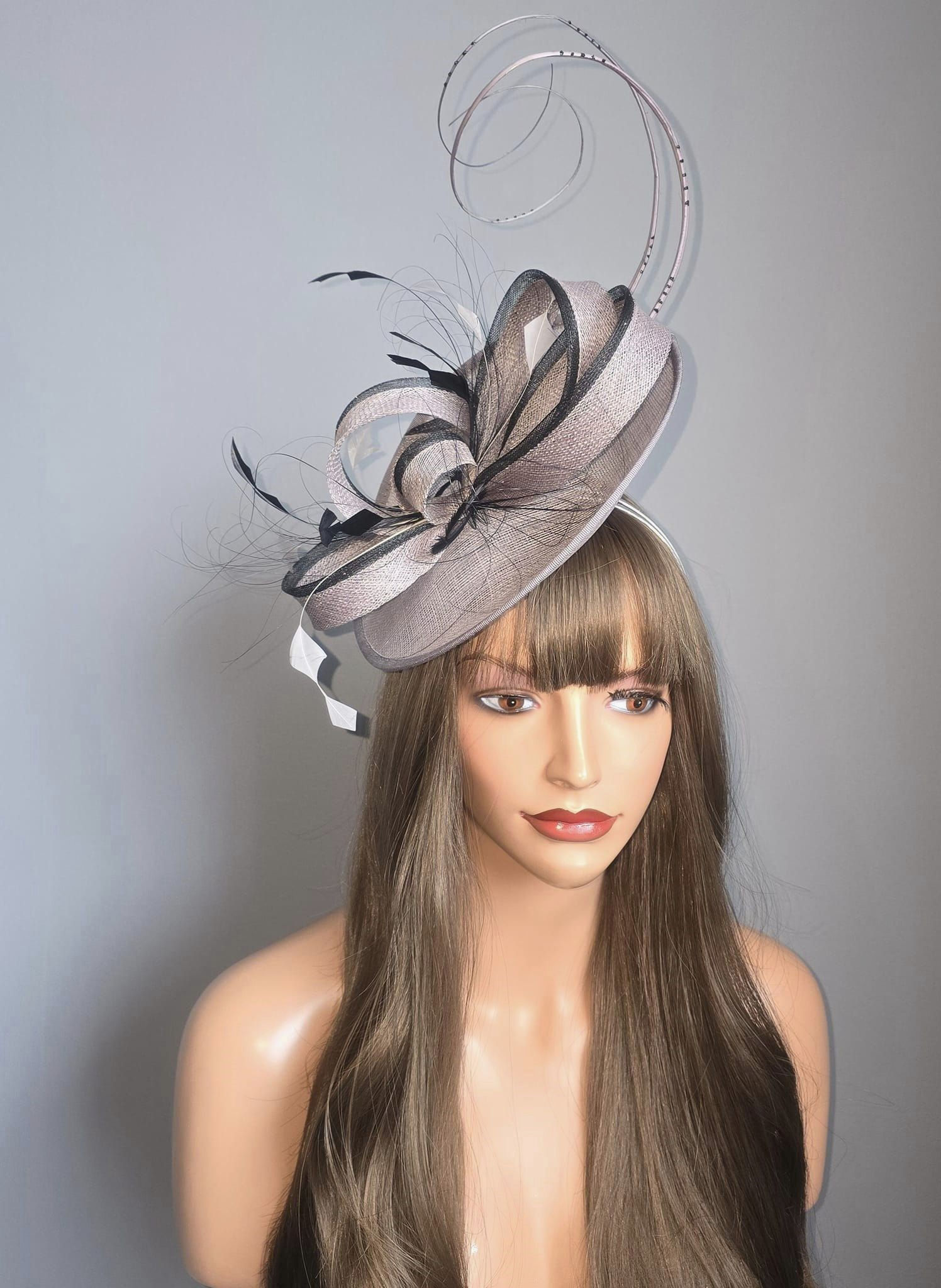 Sinamay Hatinator on a band with curled quills