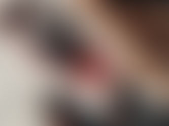 Person standing in front of a snowshoe and a bench