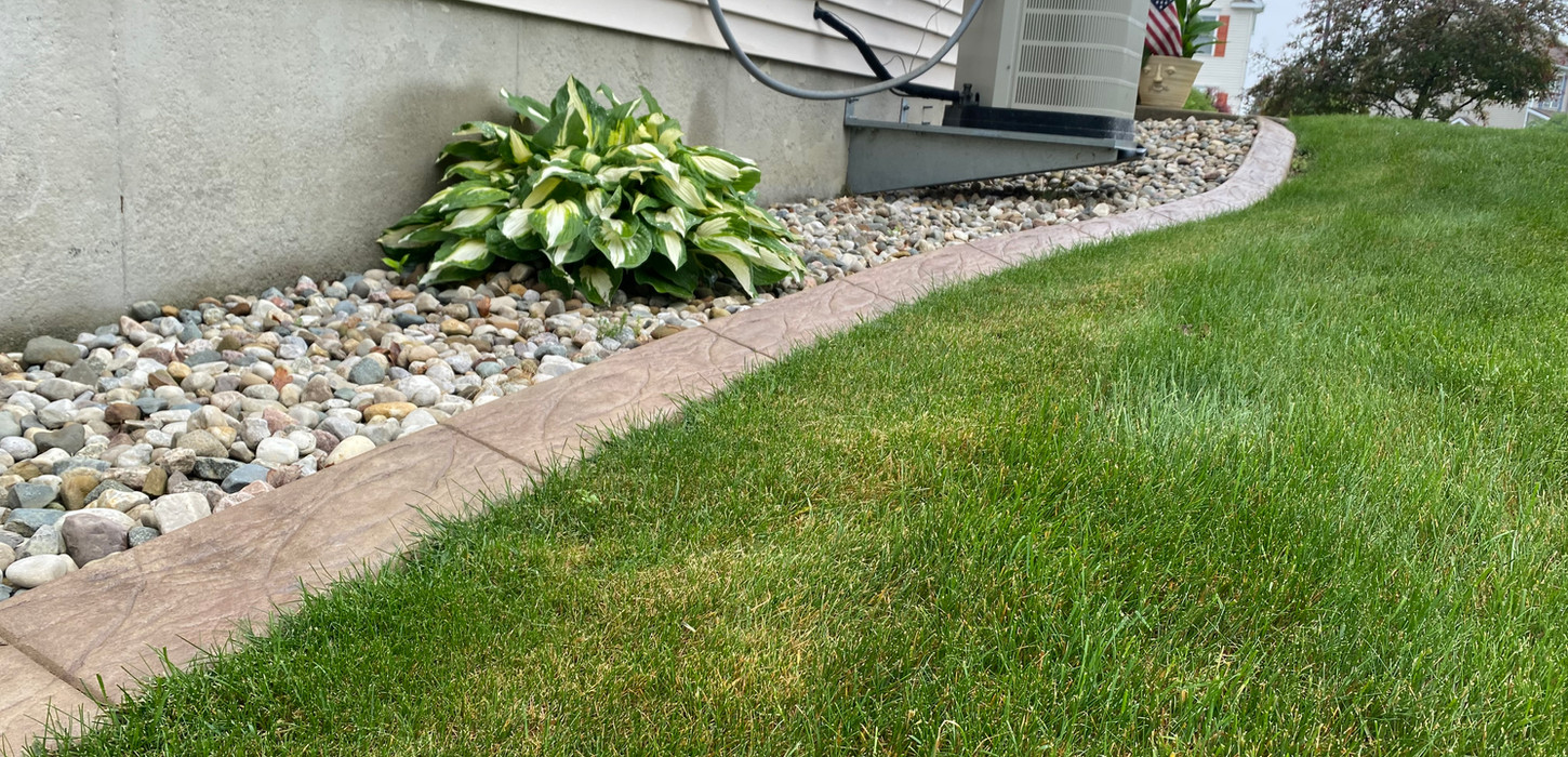 premium edge curbing next to house