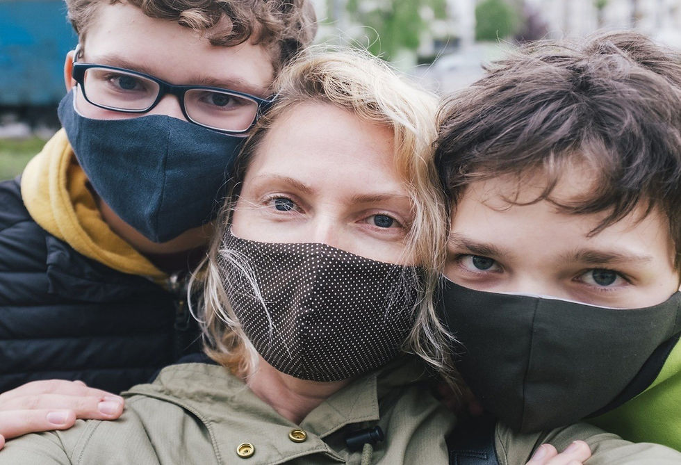 Mother and children take a photograph with protective masks during the coronavirus pandemic (ARTindividual / Getty Images)