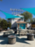 New Party patio at Buffalo Lodge in Colorado Springs featuring sun shades, cafe lights, and newly repainted buildings!