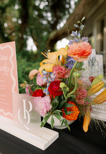 Bright ranunculus, lilies and peonies for a welcome party on Amelia Island.