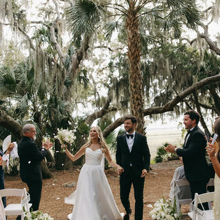 White and green wedding bouquet with hydrangea, calla lilies and seasonal foliage for a Walker’s Landing wedding on Amelia Island.