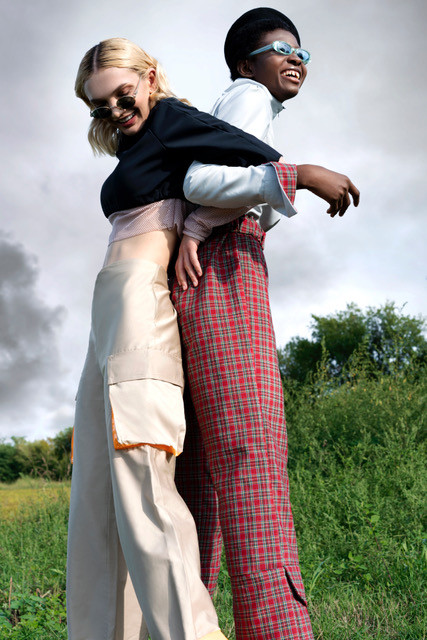 Two women dressed in typical Herero fashion style hugging