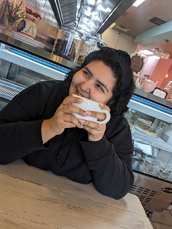 Esperanza holding a coffee mug