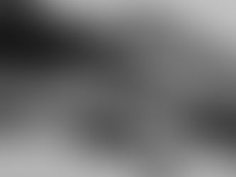 Two aged hands holding each other, displaying rings. The black and white photo conveys warmth and connection against a plain background.