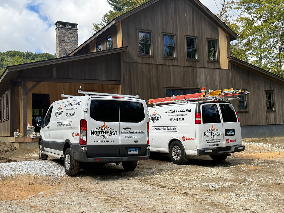 Northeast Heating & Cooling vans at a Bethany CT home.