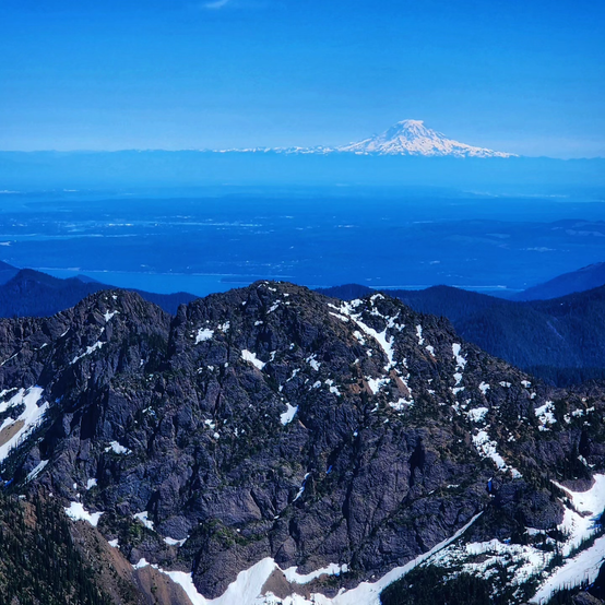 From the top of Buckhorn Mountain, looking across the Puget Sound with Mount Rainier in the background.