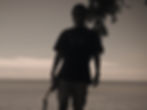 Alex Blecker silhouette, the ocen in the background 