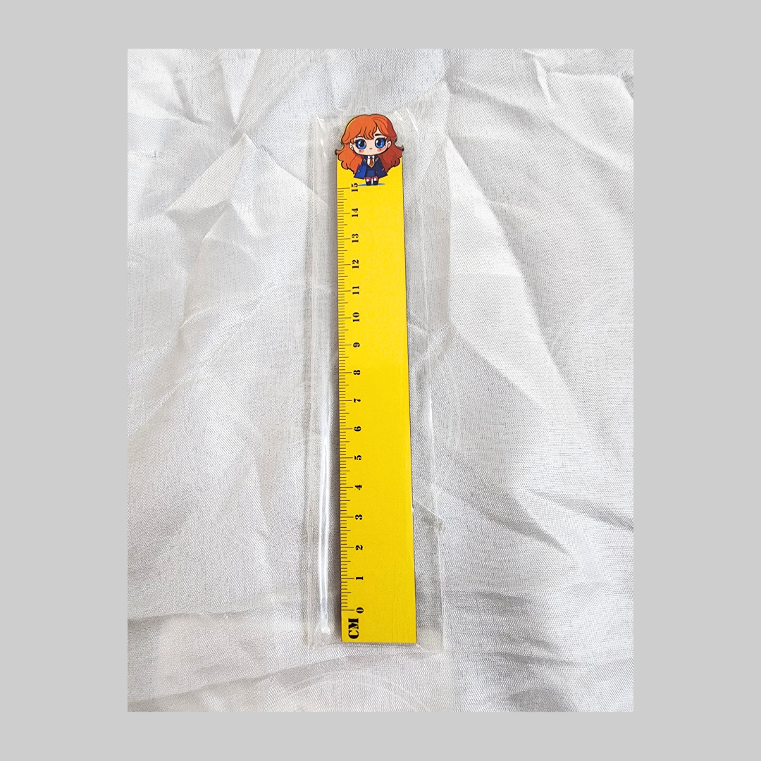 Yellow 15 cm ruler with cartoon Hermione Granger on top