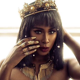 Black woman wearing a gold crown