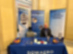 Senior VP Ray showing off DowAero's booth at the state capitol
