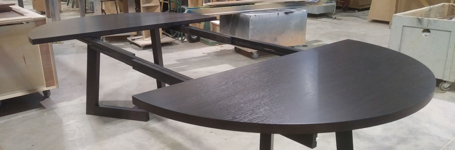 Custom dark walnut wood table in a workshop, WOODWORK, luxury kitchen cabinets, gonzalezlegacystudio.