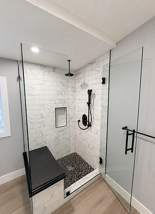 Custom bathroom renovation with walk-in tiled shower, glass enclosure, shower niche, and modern finishes by Compeau Contracting.