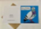 A cute pigeon stamping its feet happily with a Happy Birthday tag in its beak. The pigeon is on a blue background