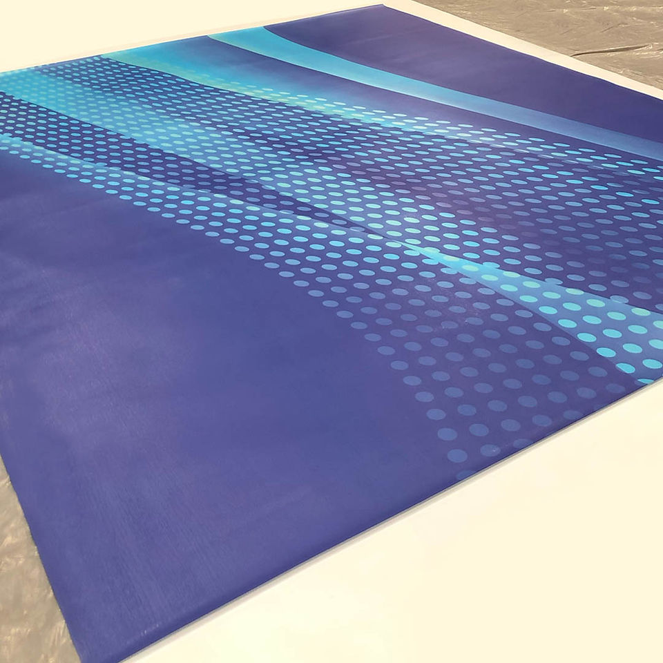 Custom RPV flooring featuring layered blue tones and modern graphic design