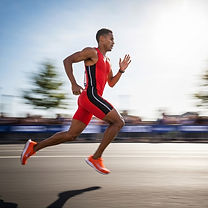 A man in extremely tight clothing is sprinting down a running track