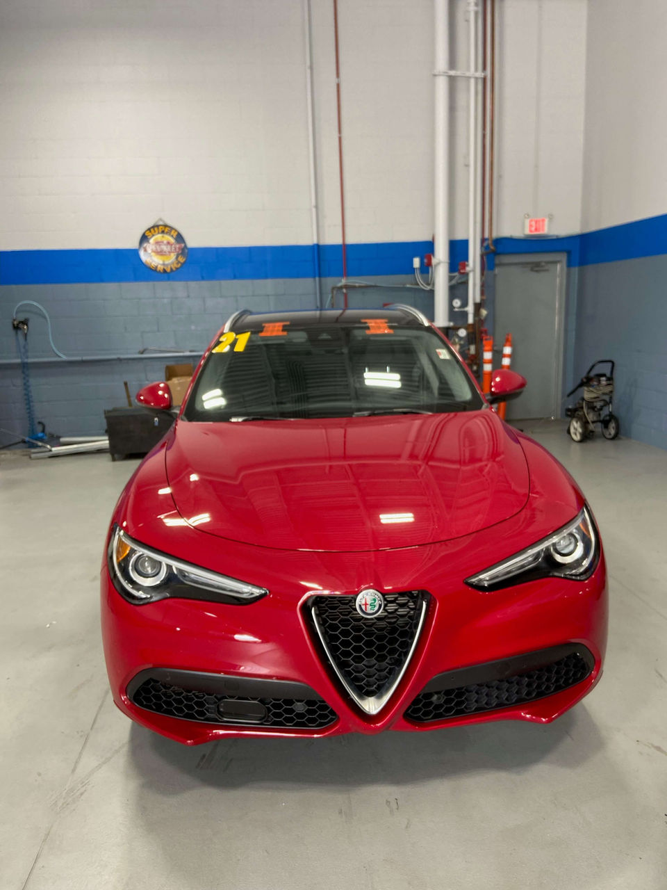 red-alpha-romeo-getting-prepared-to-auto-glass-repair-same-day-in-chicago-area