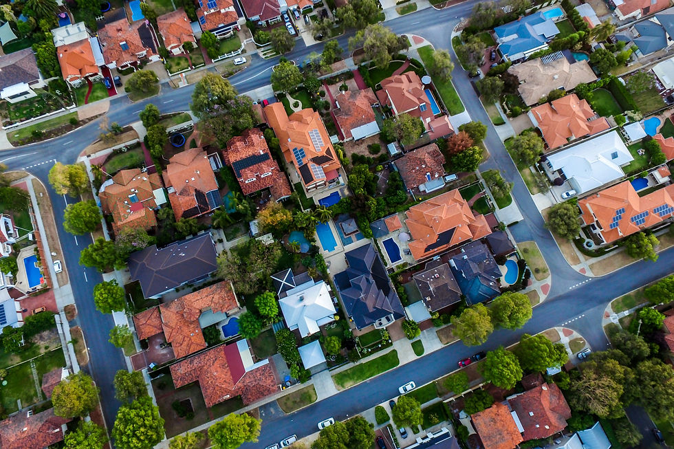 Aerial view of a suburban neighborhood with diverse house designs.