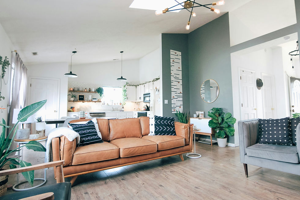 A cozy living room with a leather couch and modern decor.