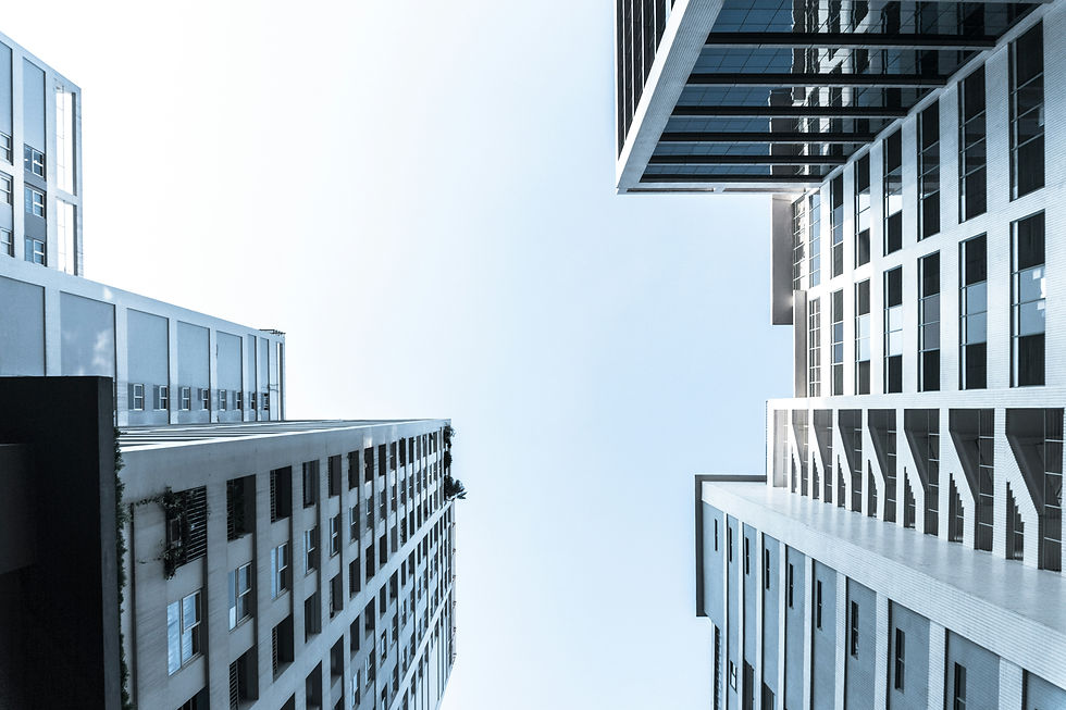 Upward view of modern high-rises against a clear sky