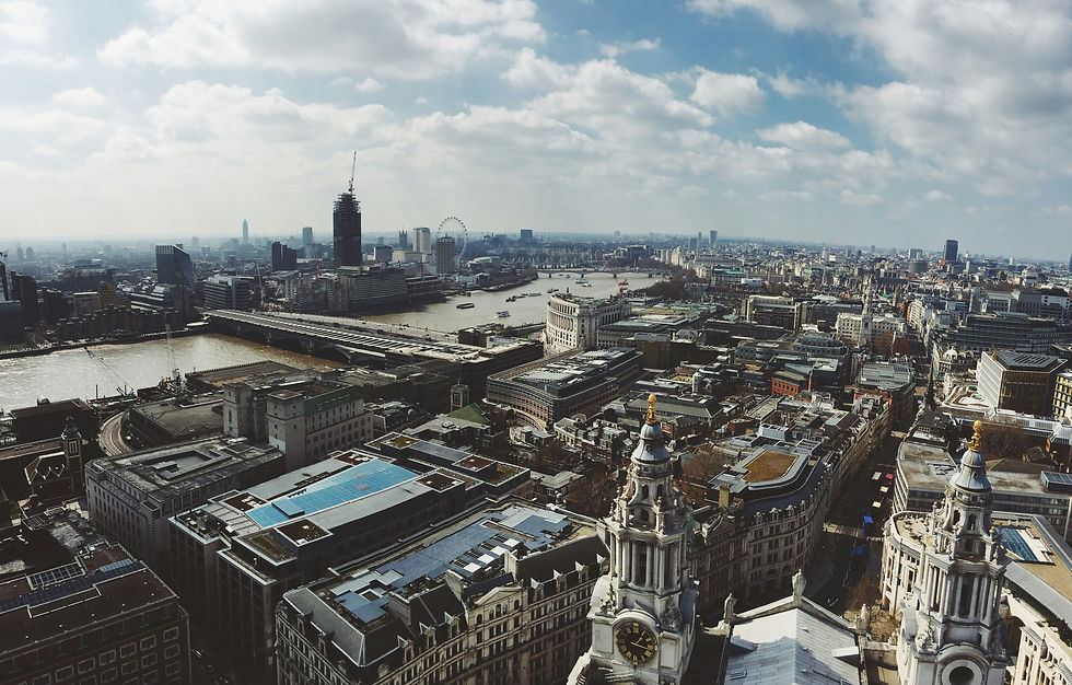 Aerial view of London showing the Thames, London Eye, and city skyline