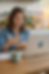 womans sits at her laptop in conversation