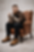 young hipster guy sits in contemplation