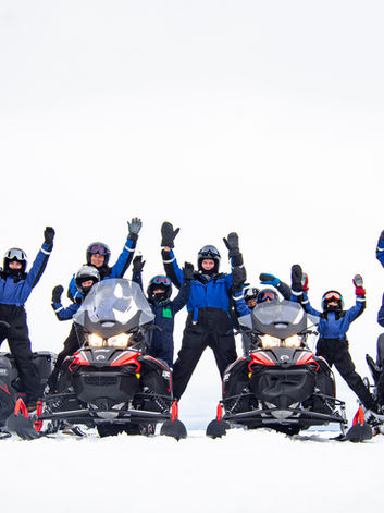 Happy guests at a snowmobile tour at Brändön Lodge