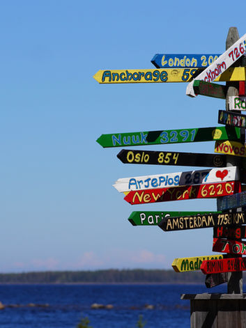 Sign that show directions to countries at Brändön Lodge