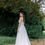 Thumbnail: A-line wedding dress with deep v neck and thin straps. Long train add royal effect to the dress.