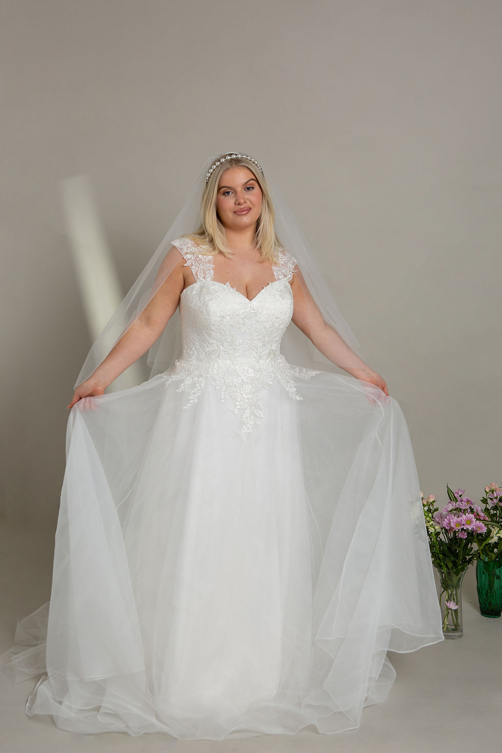 Thumbnail: designer wedding dress, lace bodice with keyhole back detail. Soft organza skirt.
