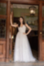 Lace bodice and tulle skirt wedding dress. A line silhouette and v neck. long train and lace on the bodice