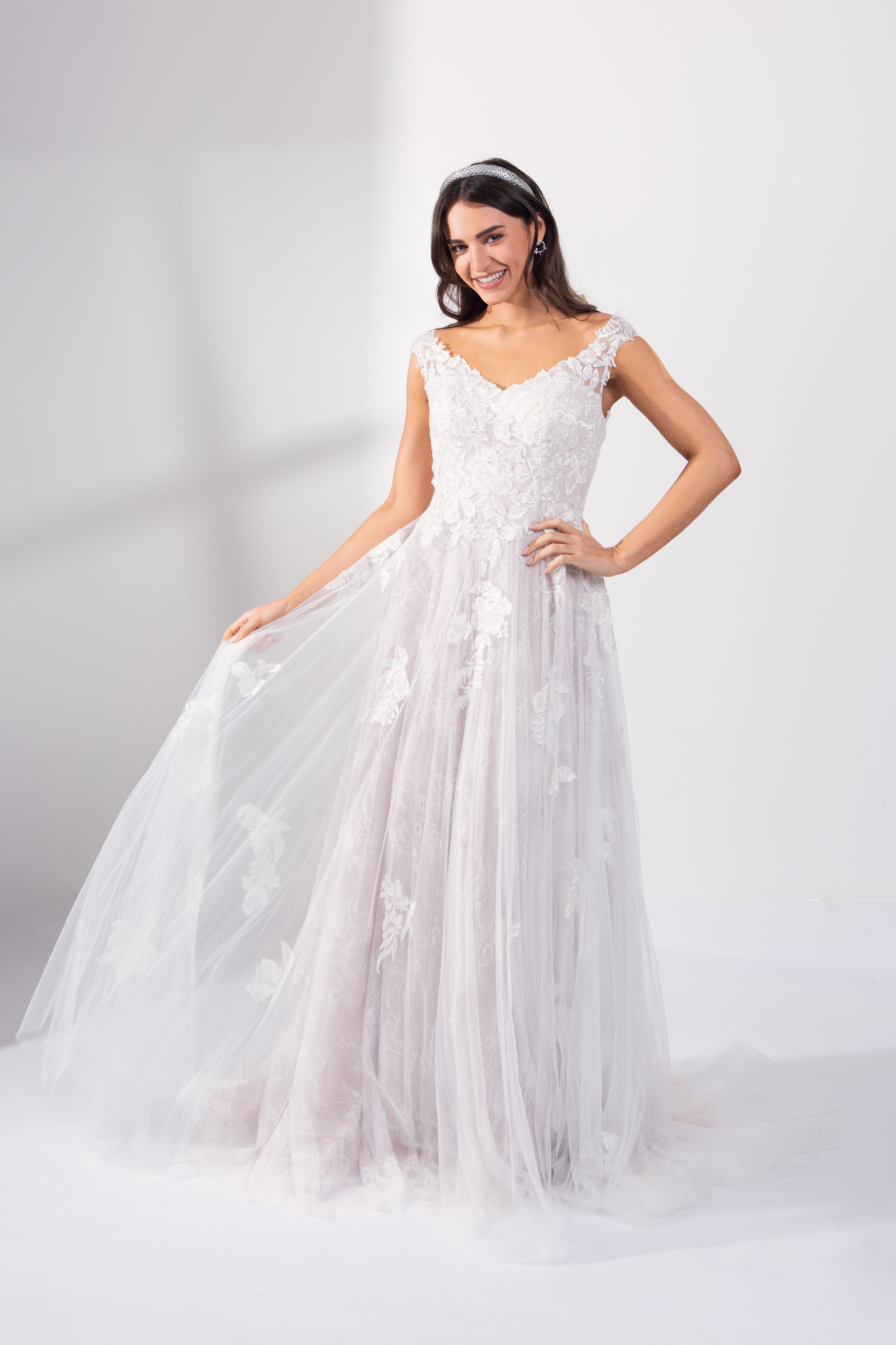 Boho style lace wedding dress with keyhole back. Pale pink bridal for outdor boho style wedding