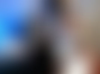 A stressed bride and groom sitting at a table cluttered with wedding planning papers and music equipment, showing frustration and confusion while choosing a wedding DJ, capturing the tension of common booking mistakes.