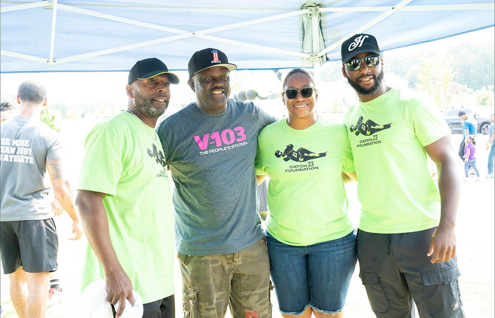V103’s Greg Street w_ the Harris family.jpeg
