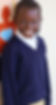 A smiling student at Promise Village Academy