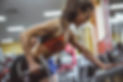 A personal trainer showing the right way to train oneself with weights.