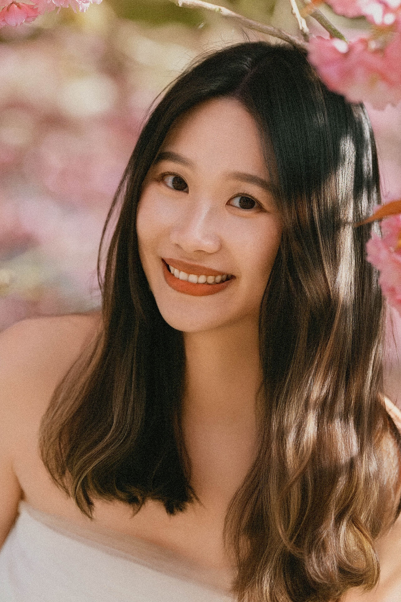close up of bride during cherry blossom prewedding shoot