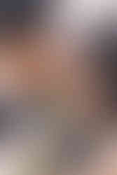 the couple kissing in front of the pragser wildsee with the mountain backdrop