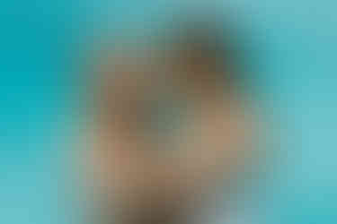 bride and groom in the pool nose to nose having their intimate moment