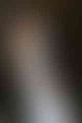 bride and groom kissing at the grand exit with bubbles