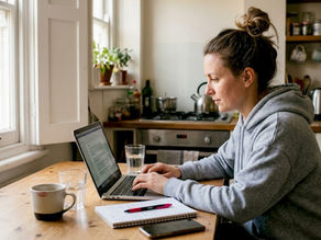 Woman writing ecommerce product descriptions at kitchen table
