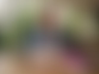 Woman recording user-generated content at kitchen table