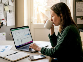 Marketer reviewing lookalike audience ads at kitchen table
